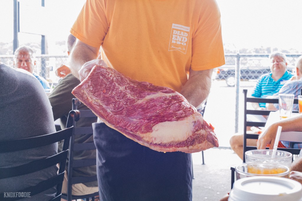 Cooking Class: George showing off the beautiful cuts of meat - Dead End BBQ