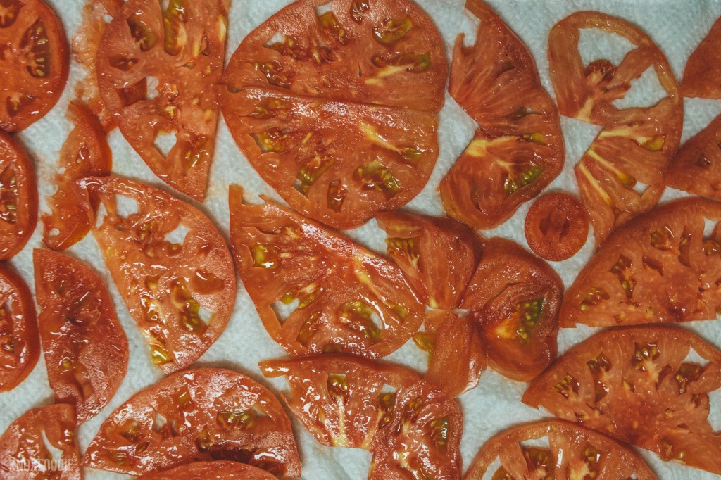 Salt each tomato slice on both sides and allow to 'sweat' for 10 minutes.