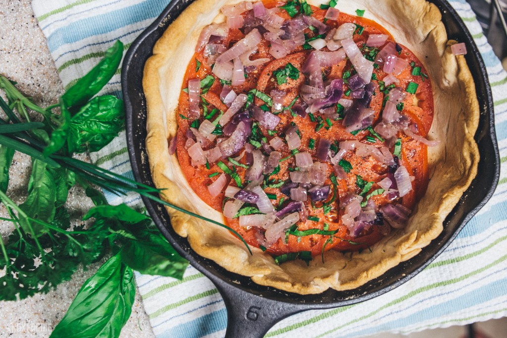 Layer tomatoes, pepper, herbs, and onion mixture.