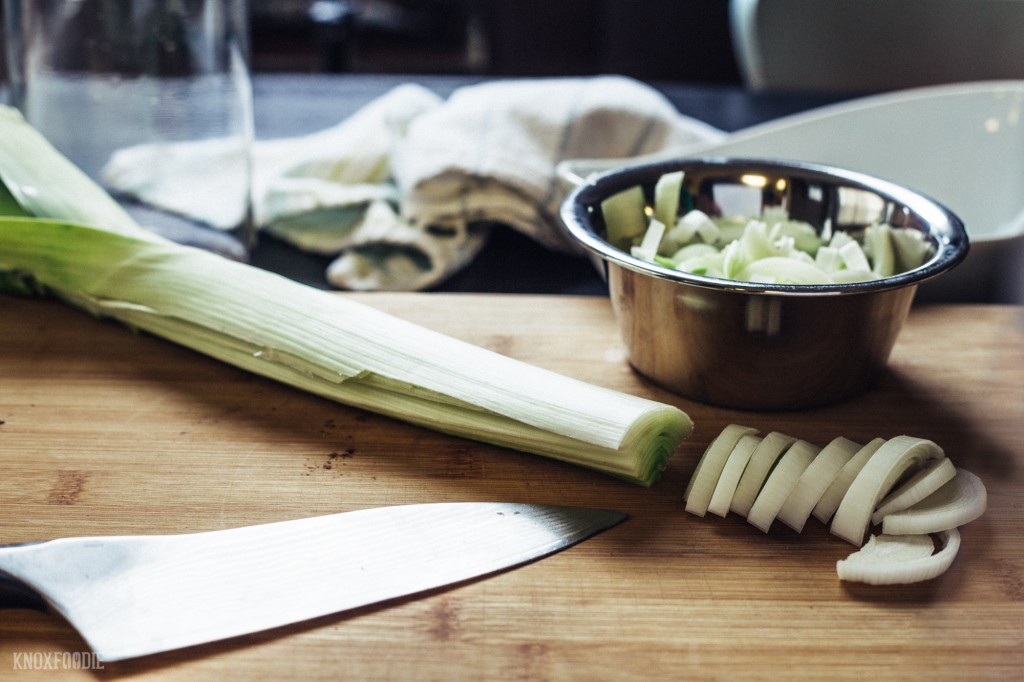 Cut leeks in half and clean dirt out before thinly slicing.