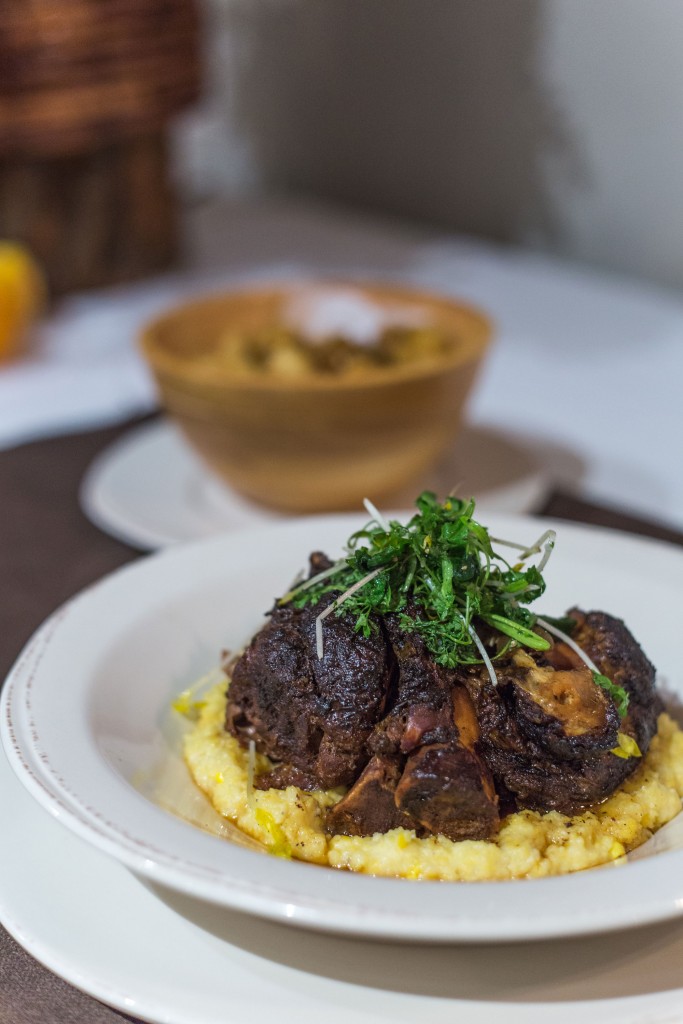 Pork Osso Bucco - Creamed Corn Grits, Garden Cress, and Spiced Brandy Gravy