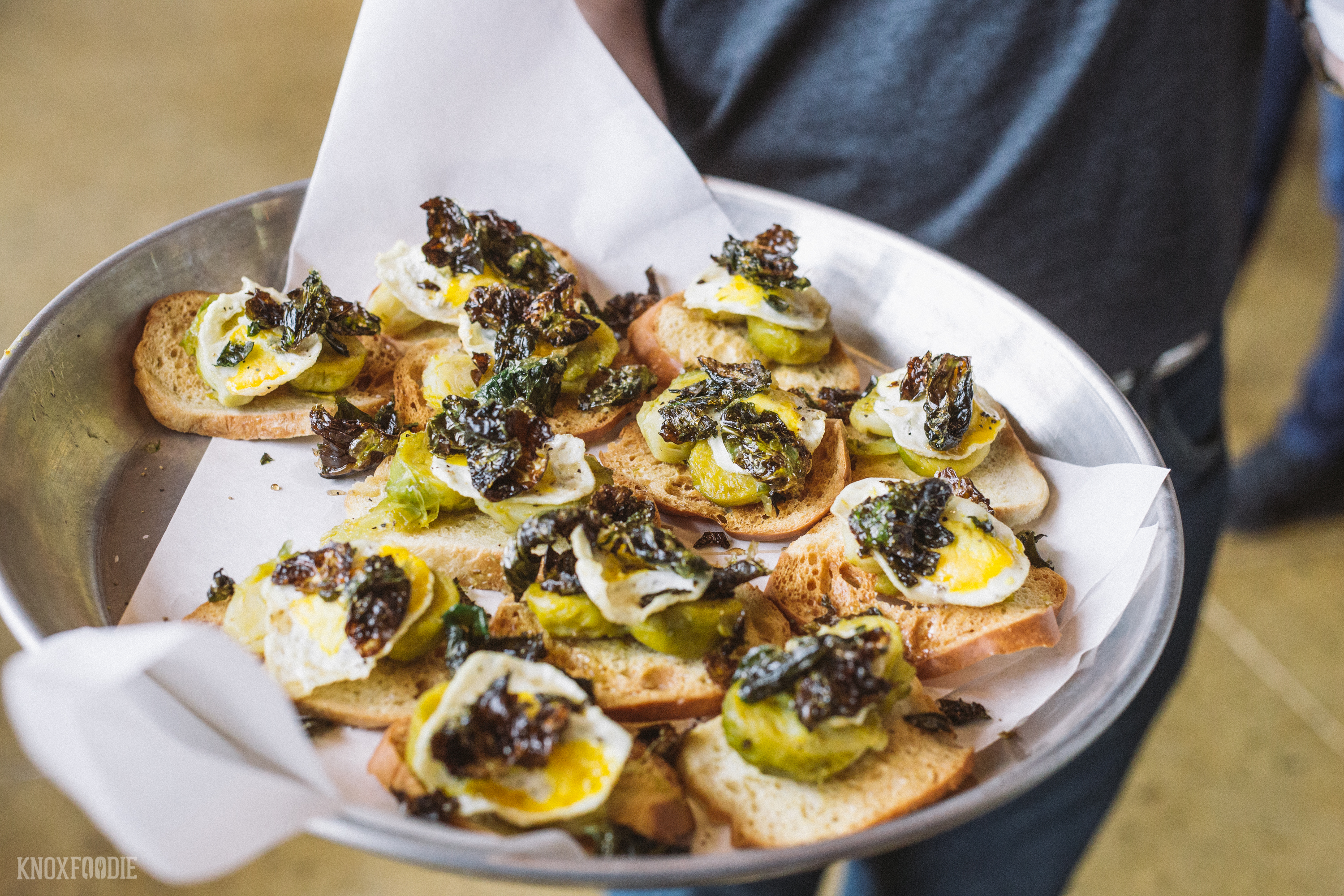 Crostini with roasted brussels sprouts, fried quail egg and maple.